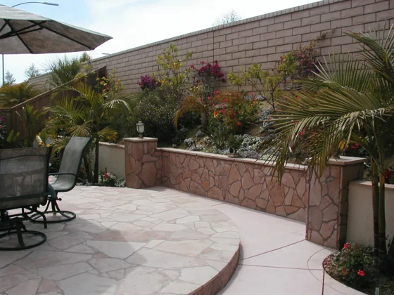 Brick garden wall and paved courtyard