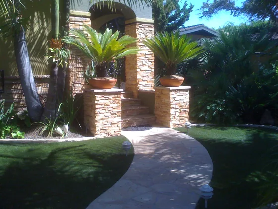 Stone pillars and landscaped pathway