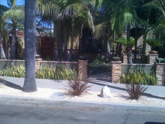 Palm garden with stone entry pillars
