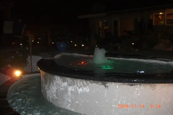 Illuminated water feature at night