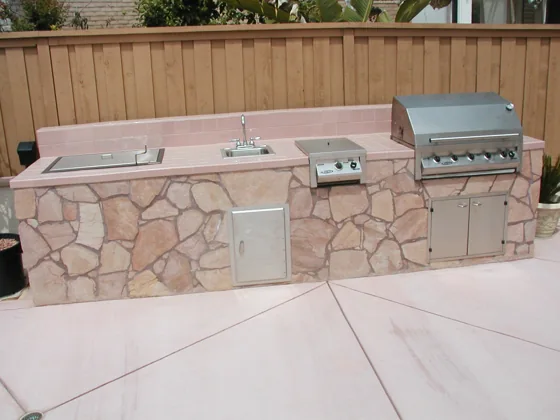 Built-in barbecue with stone facing