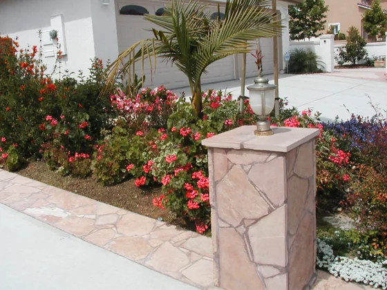 Stone pillars and flowering garden